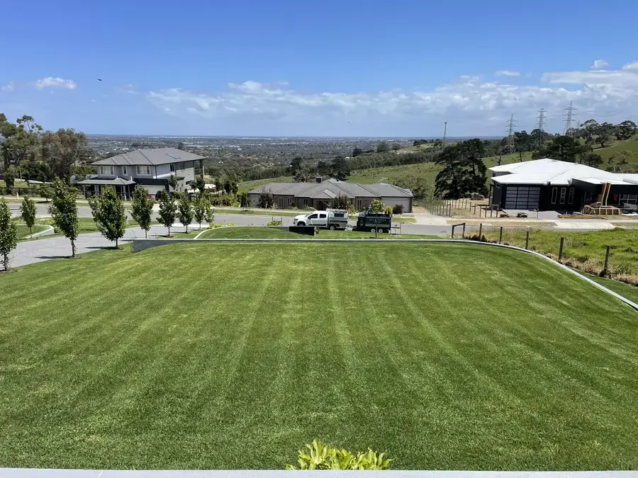 Freshly mown acreage lawn with a rural outlook beyond the boundary