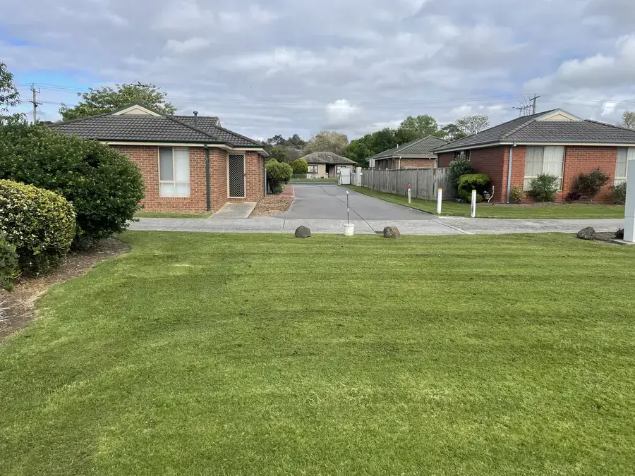 Common area lawn in a townhouse court maintained by Blue Hills in Pakenham VIC