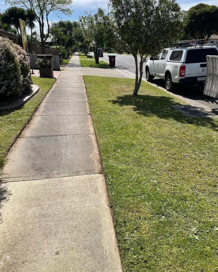 Nature strip and footpath mowed and edged by Blue Hills on a residential street